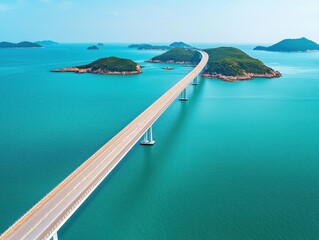 Fototapeta premium Beautiful aerial view of a long bridge connecting islands over turquoise waters.