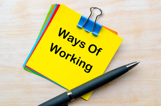 Ways of Working text on yellow notepad representing new business culture concept