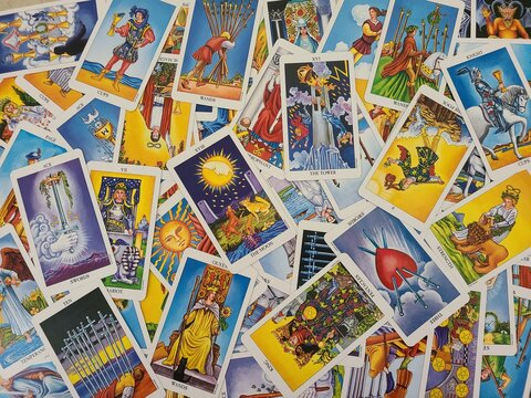 Pile of Tarot Cards, Radiant Rider-Waite Deck, Tower, Moon, Fool, Three of Swords