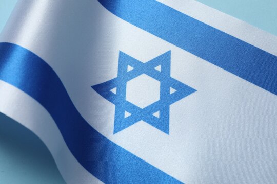 National flag of Israel on blue background,  top view and space for text. National symbol