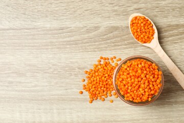 Red lentils on a wooden background