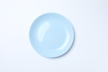 Blue empty plate on a white background