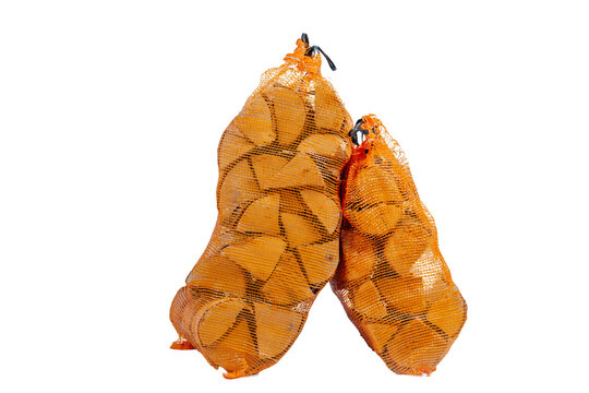 Two orange mesh bags filled with chopped firewood logs, isolated on a transparent background. Ready for transport, storage, or use in fireplaces and campfires..