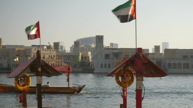 sunny day dubai city famous deira district touristic boat traffic slow motion panorama 4k uae 