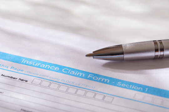 Close-up of insurance form with pen