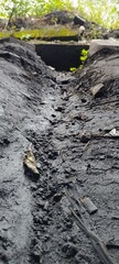 water channels or gutters that are still made of soil
