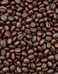 Obraz premium Dry, oily, rough, uneven surface of dark brown coffee beans, rich, organic