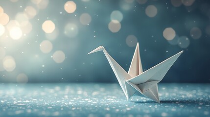 Elegant origami crane against a soft, dreamy, sparkling background