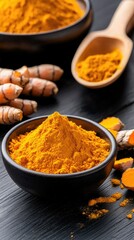 Bright yellow turmeric powder and fresh roots displayed in a dark setting for culinary and medicinal use