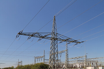 Electricity pylon on an overland route in Germany against a blue sky