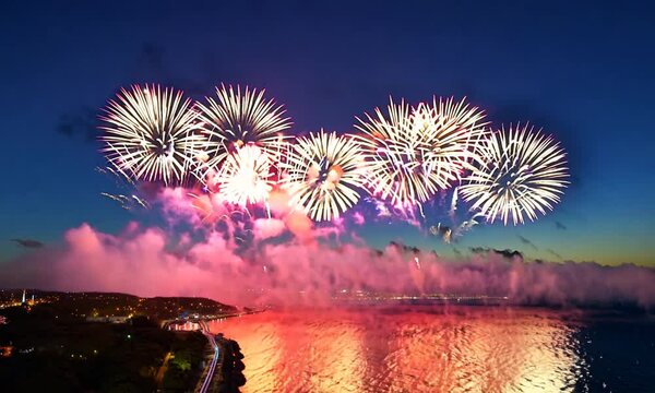 Amazing beautiful colorful firework display over sea on celebration night