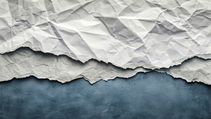 Obraz premium A photograph of crumpled paper creating the illusion of a mountainous landscape. Gray and blue shades convey the effect of a natural landscape.