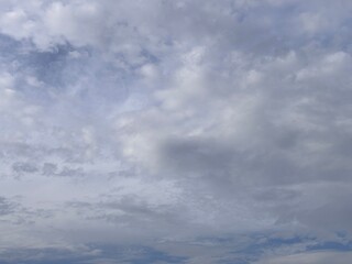 Obraz premium beautiful morning blue sky gradation sunrise sky background, beautiful cloudy sky sunlight from the side, dramatic feel, it's going to rain