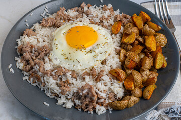 fried egg with  rice  and crumble sausage