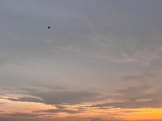 Beautiful sky with natural gradations. Thick clouds in the dusk sky on a winter night. Image of a cloudy sky in the afternoon. View of the night sky with golden light from the evening sun