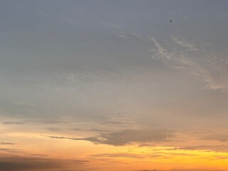 Beautiful sky with natural gradations. Thick clouds in the dusk sky on a winter night. Image of a cloudy sky in the afternoon. View of the night sky with golden light from the evening sun