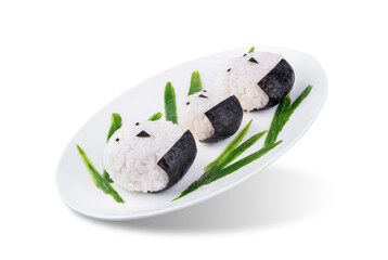 Rice ball onigiri with filling in the form of chicken with funny faces in a plate on a white isolated background