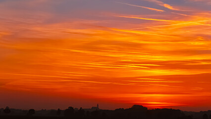 Sunset with a church silhouette near Arbing, Osterhofen, Deggendorf, Bavaria, Germany