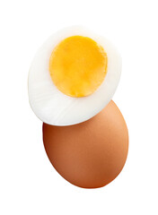 Front view of raw brown chicken egg and cooked or boiled chicken egg with egg yolk in half in small pile isolated on white background with clipping path