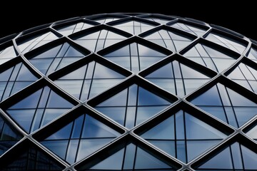 A striking architectural structure featuring a geometric glass dome, reflecting the sky and creating a modern aesthetic.