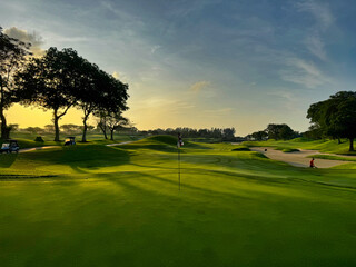 Sunrise at a golf course © Florian