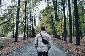 young man walking in the woods