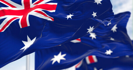 Australian flags waving dynamically, photorealistic 3D render of national pride