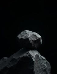 Naklejka premium A stack of rocks on top of each other in the dark