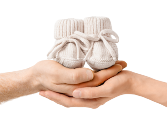 Male and female hands holding baby booties. isolated on white background. concept family