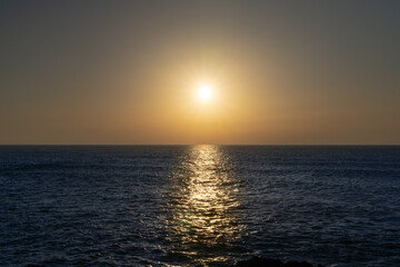 Sunset on the sea with a haze sky