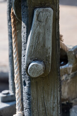 A tiny well with water coming from a bucket