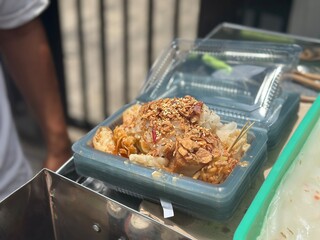 Ci Cong Fan – silky rice noodle rolls topped with siomay, uyen, radish, and dumplings, served...