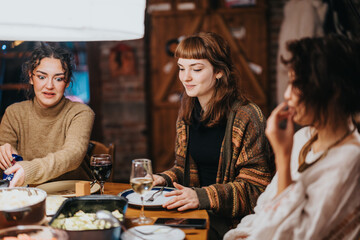 A lively gathering of friends enjoying a delicious dinner together in a cozy setting. They share stories, laughter, and good food while creating joyful memories.