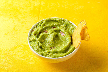 Nachos with guacamole, traditional Mexican snack