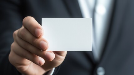 Hand Holding Empty Business Card Close-Up