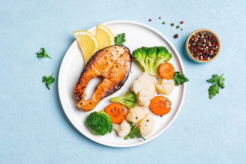 Grilled salmon fish steak with steamed vegetables