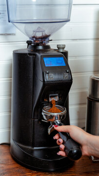 Preparing Fresh Espresso with a Modern Coffee Grinder