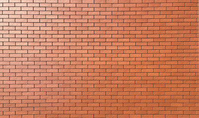 A high-resolution image of a rustic red brick wall. 