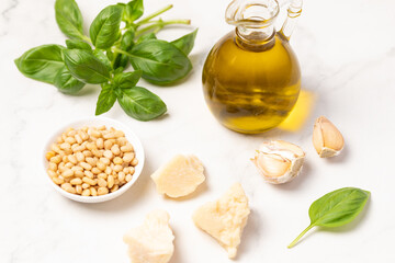 Ingredients for making Pesto sauce, parmesan, pine nuts, basil, olive oil
