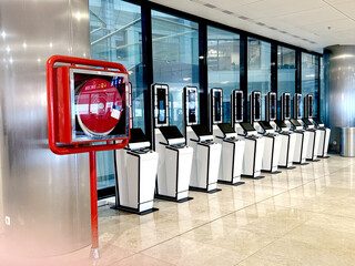 Modern airport with self-service kiosks and fire safety
