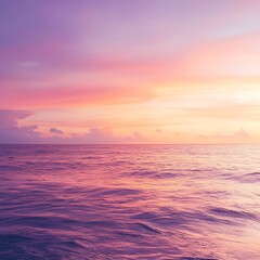 Obraz premium Serene sunset over the tranquil ocean, with vibrant colors reflecting on the water's surface