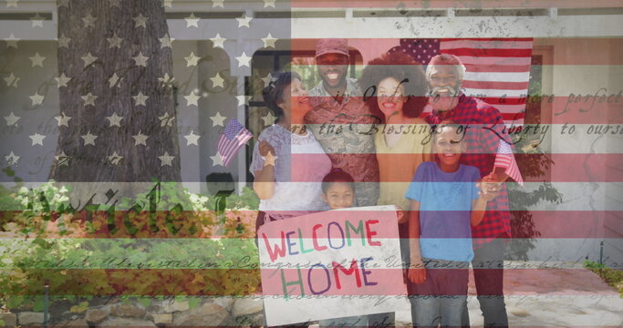 Image of male soldier embracing smiling family over american flag