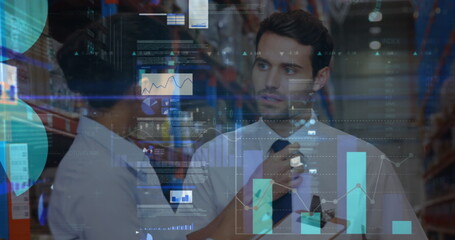 Screens with data processing against male and female supervisor talking to each other at warehouse