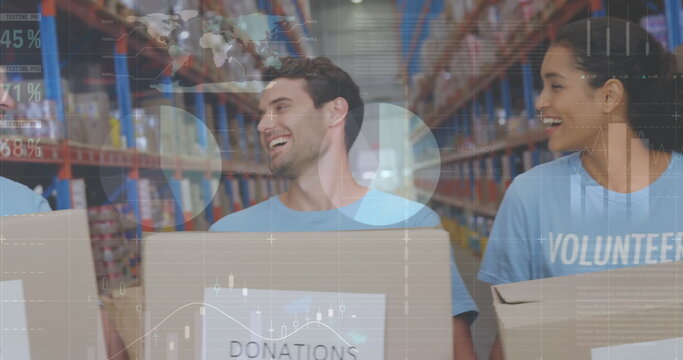 Statistical data processing against male and female volunteers holding boxes smiling at warehouse