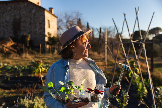 Woman Enjoys Gardening Outdoors in Rural Setting of Barcelona
