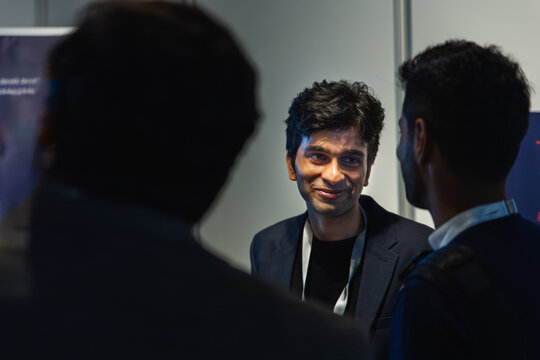 Business men professionals networking at a conference event of AI