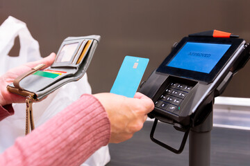 Credit card payment transaction at retail checkout counter