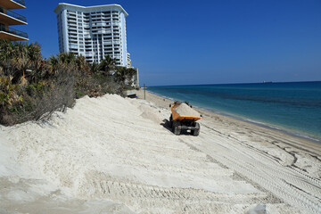 Beach erosion along the Atlantic Ocean requires a sand replenishment project to protect the remaining sand dune.