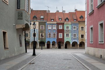 Colorful medieval merchant houses with arches on the old market square, Stare Rynek in the city centre of Poznan, Poland. Wonderful must-see touristic spot. Old houses with different colors, architect