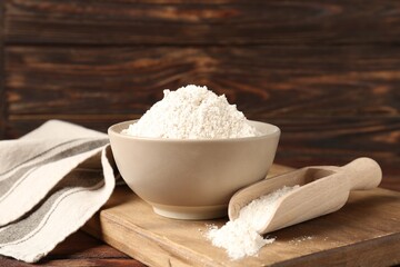 Brown rice flour on wooden table, closeup